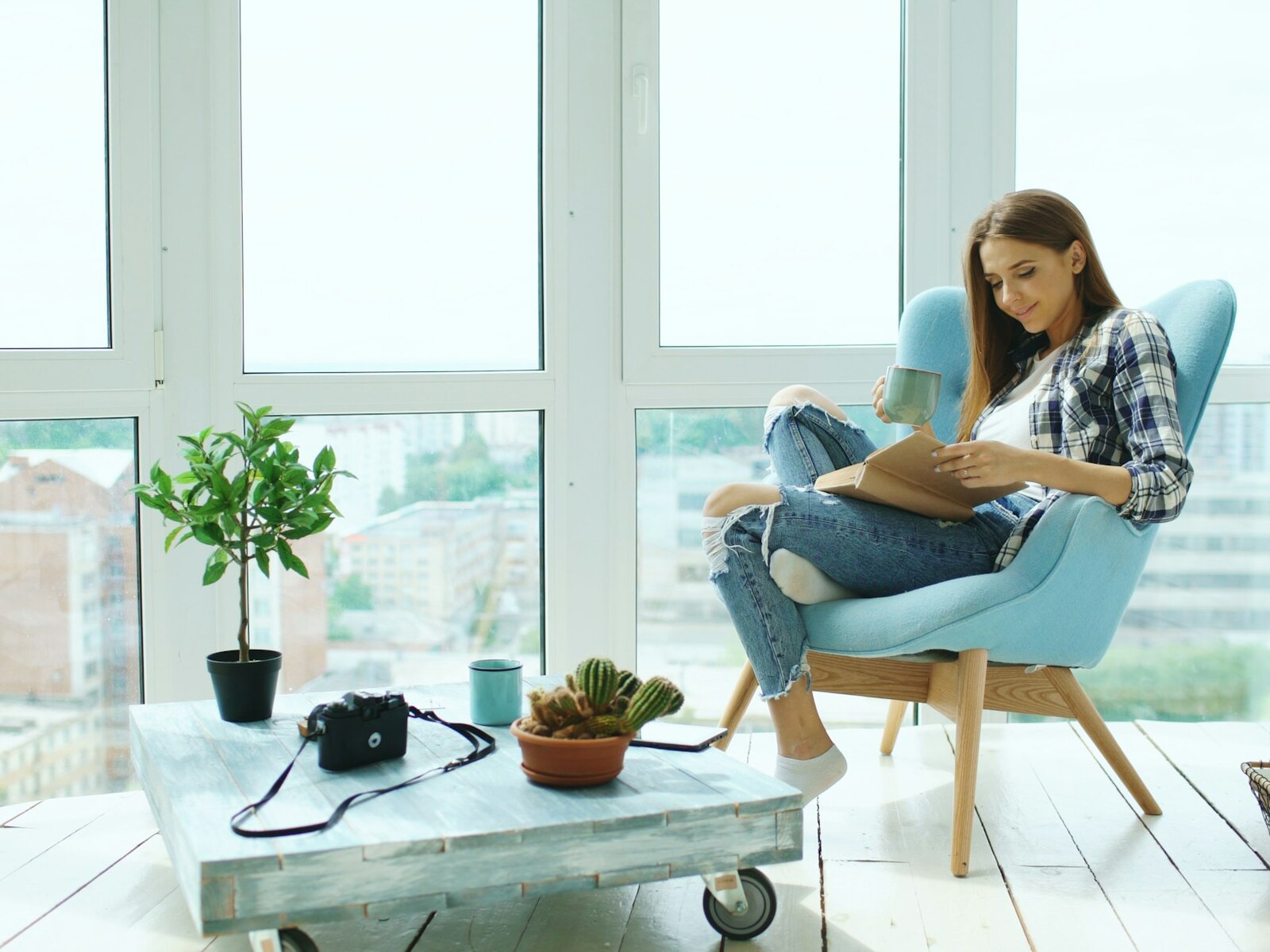 A reader in an armchair in a quiet corner of the shop